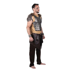 Man wearing a detailed warrior costume with armor and faux leather accents on a white background