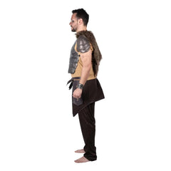 Person wearing a warrior costume with armor and faux fur on a white background
